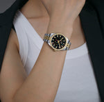 Seychelles Rainbow Dial Two-Tone Watch styled on female wrist with professional outfit
