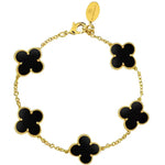 A gold-plated black onyx bracelet featuring a four-leaf clover design.