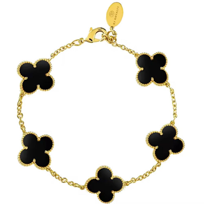 A gold-plated black onyx bracelet featuring a four-leaf clover design.