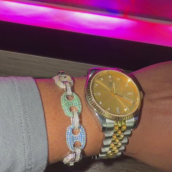 silver mariner link bracelet with diamonds and champagne watch on wrist 